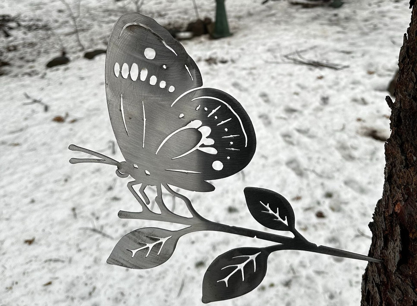 Metal Butterfly on Hammer in Branch