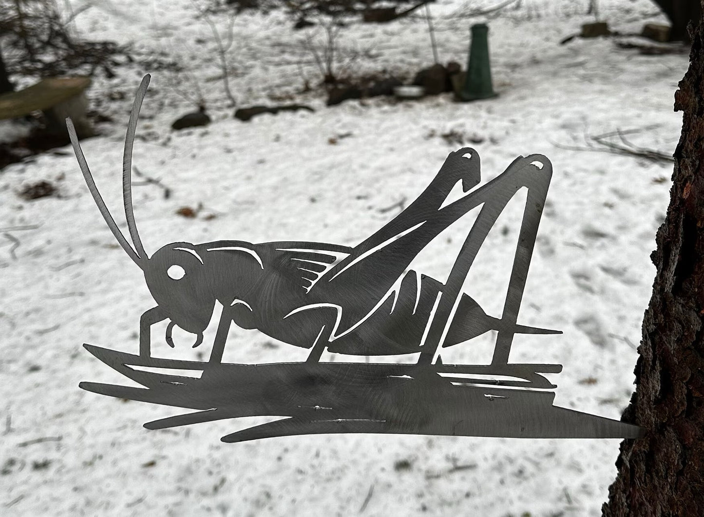 Metal Grasshopper on Hammer in Branch